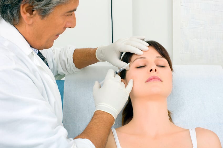 18 Doctor Performing Botox Treatment To Patient