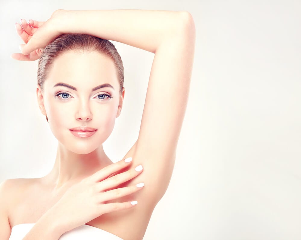 19 Woman touching her underarm