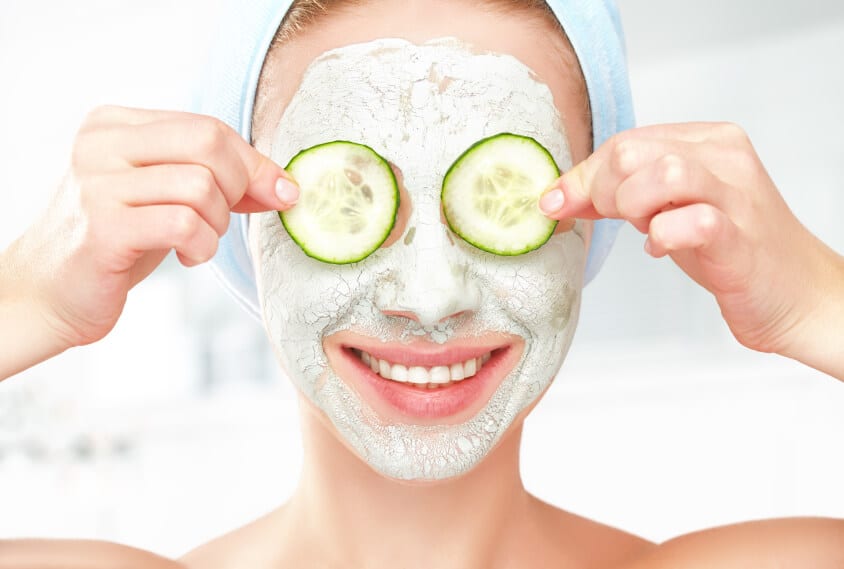 35 Woman putting cucumber in her eyes
