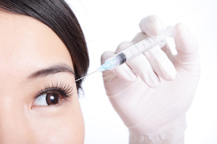 38 Woman's eyes being injected with Botox