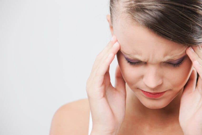 45 Woman holding her temple due to headache