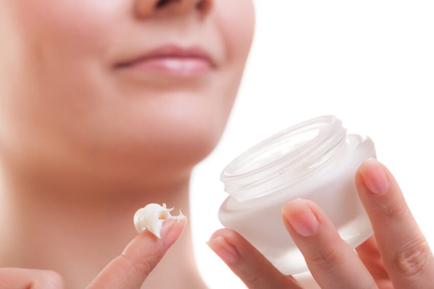 59 Woman holding skin care cream