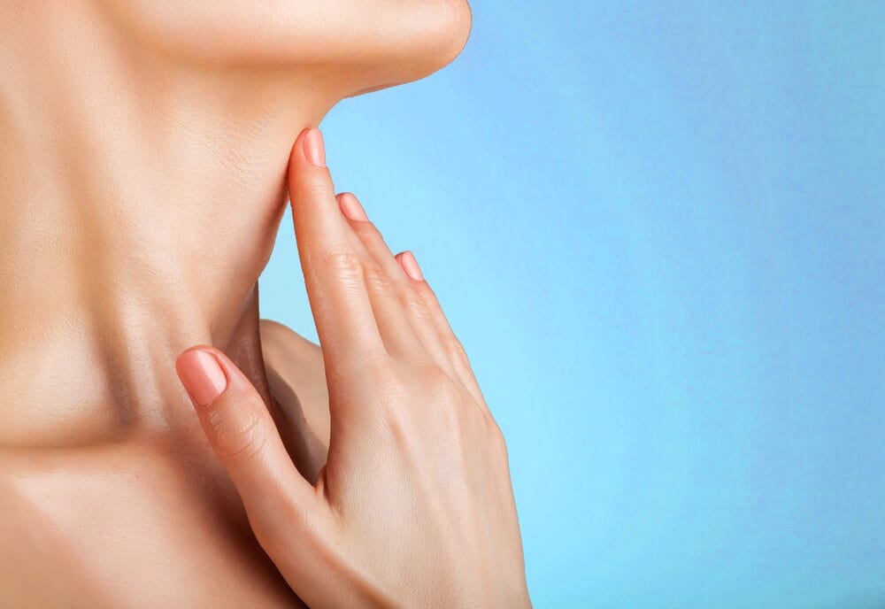 7 Woman touching her neck