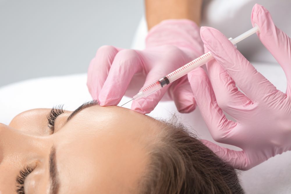 BotoxInjectionYLSC A woman receiving Botox injections in her forehead.