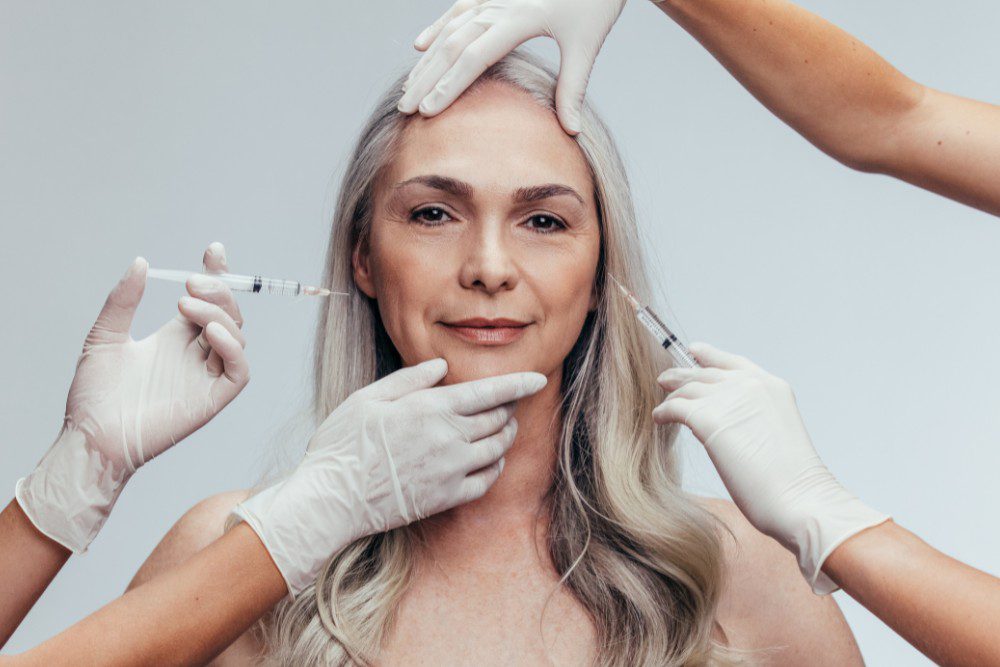 BotoxOverdoneYLSC A woman receiving multiple units of Botox around different areas of her face.