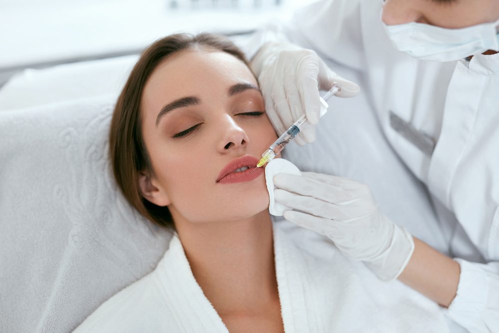 First time lip filler patient expections Lip Augmentation. Woman Getting Beauty Injection For Lips