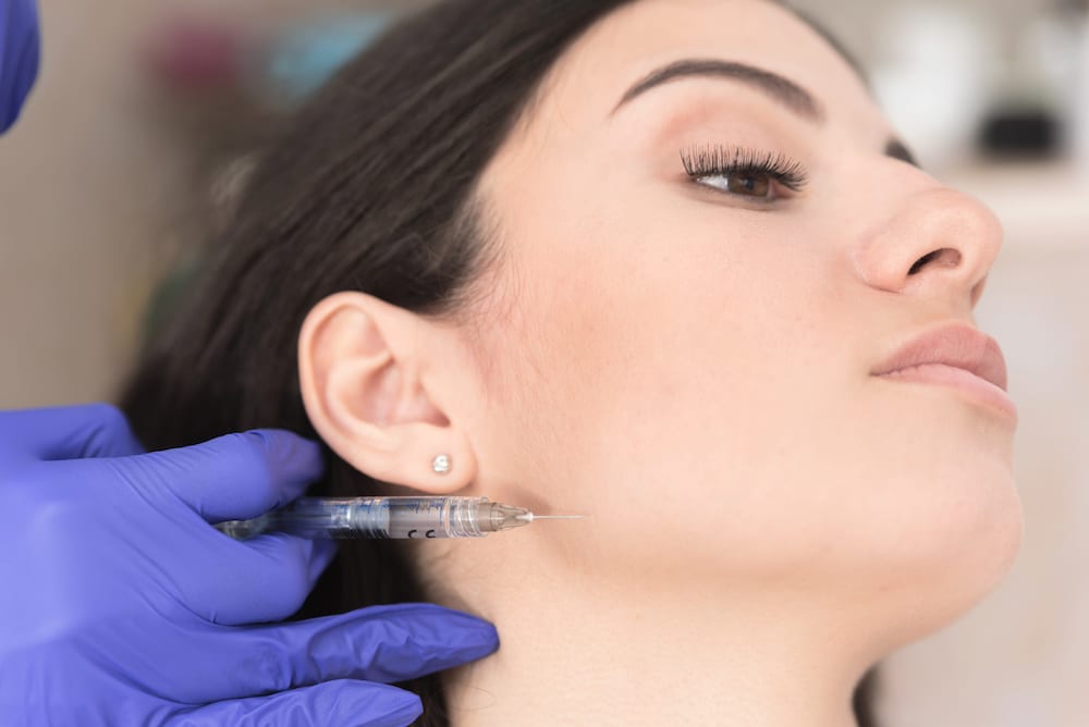 woman getting botox in her jaw