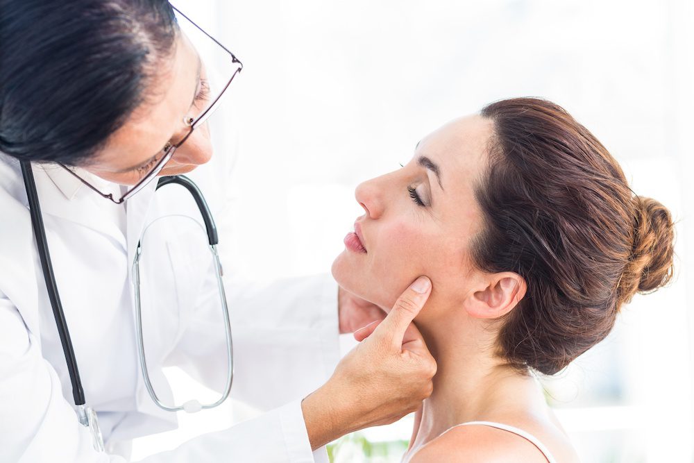 How Does Botox Help with TMJ? woman discussing botox with her doctor to treat TMJ