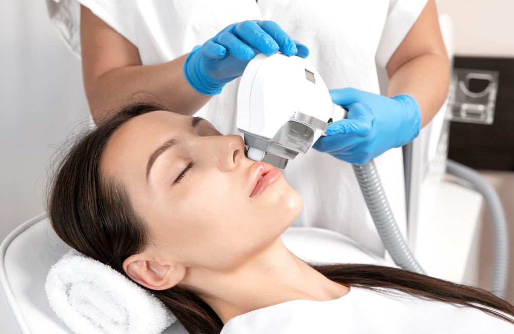A woman receiving IPL treatment to treat her sun damaged skin.