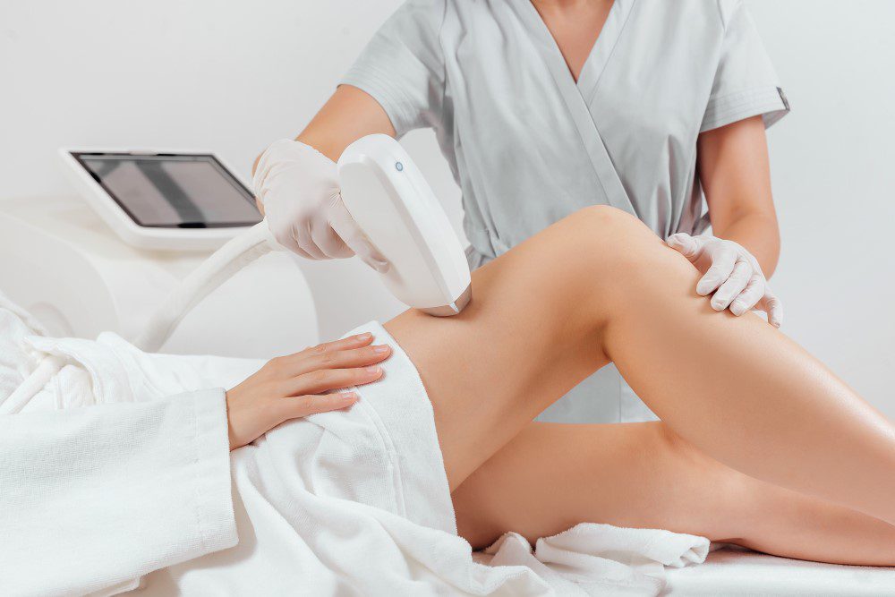 LaserHairRemovalYLSC Young woman making body hair removal laser depilation in beauty center.