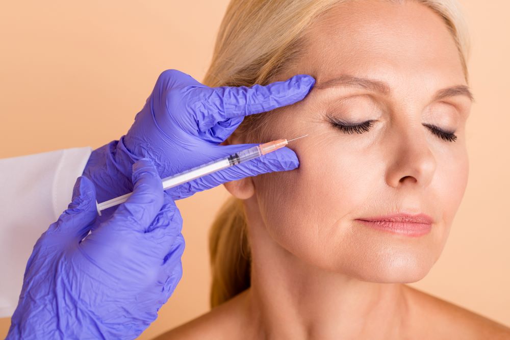 LongTermEffectsBotoxYLSC An older woman receiving Botox injections in for wrinkles around the eyes.