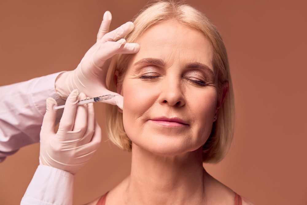 SunkenCheekBotoxYLSC A woman receiving Botox injections on her cheeks.