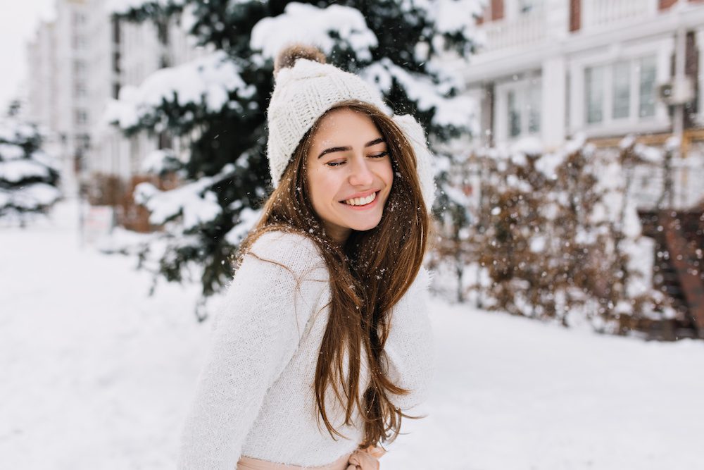 Why Winter is the Best Time for Facial Laser Hair Removal woman after facial laser hair removal appointment in the winter