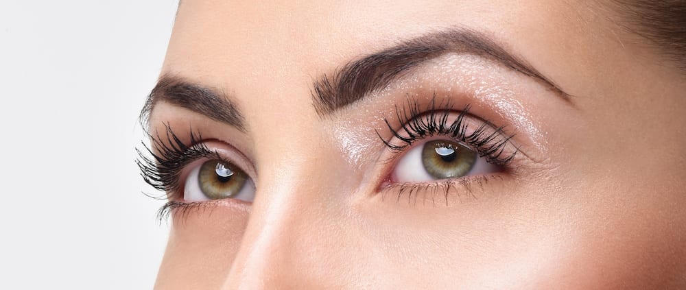 Closeup shot of woman eye with day makeup. Long eyelashes