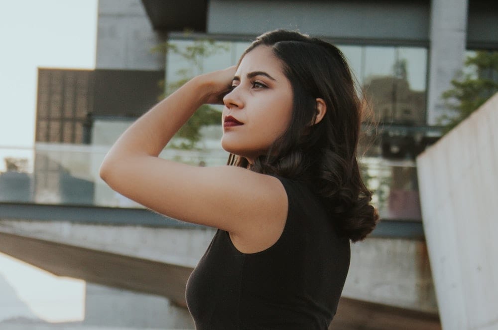 how-make-fillers-botox-last-longer Woman fixing her hair